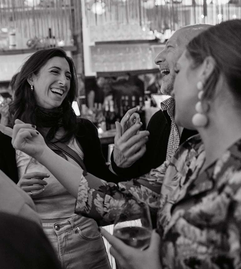 Group of people laughing a Tiki Bar in New York City NYC.